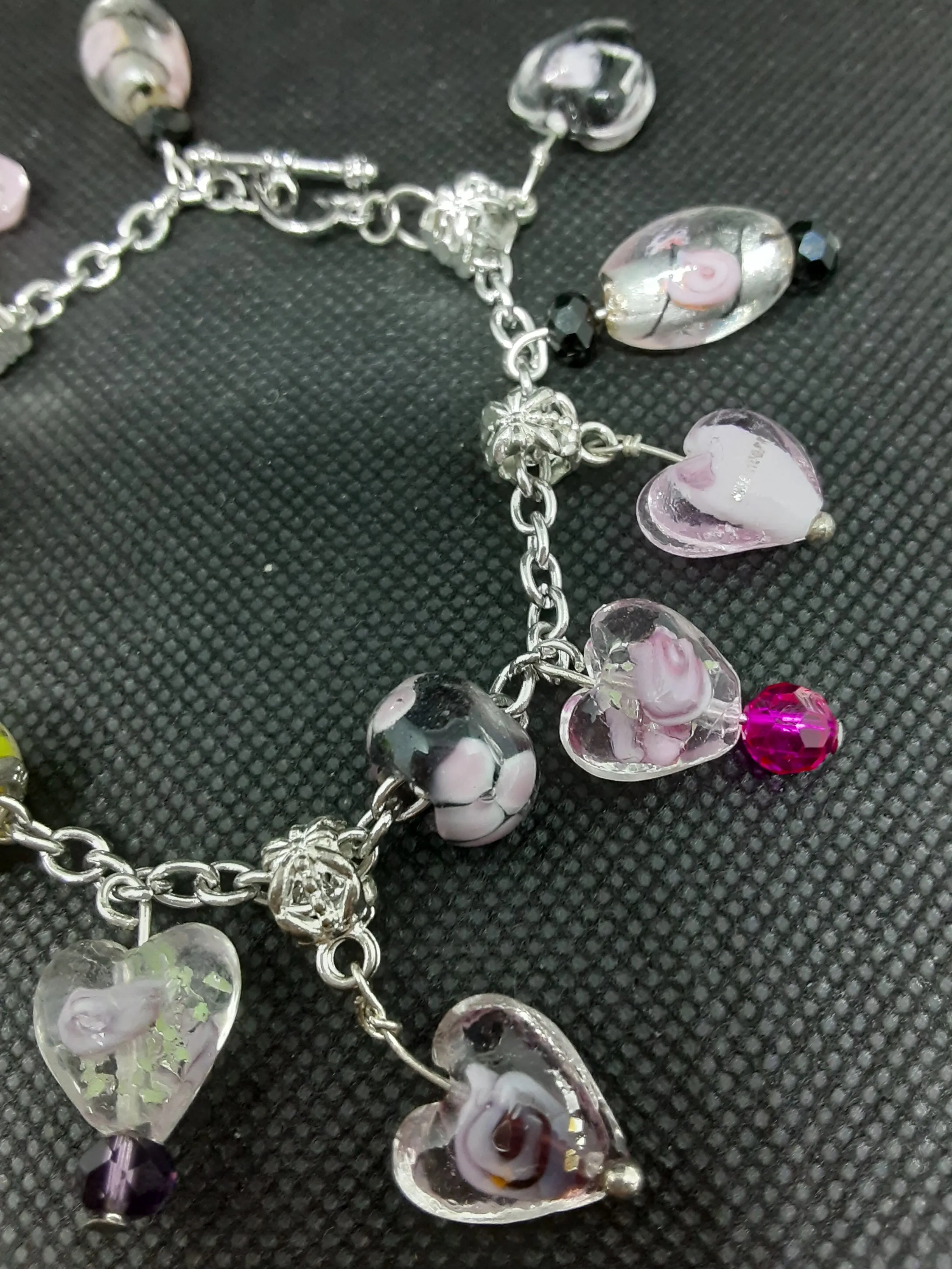 B #100  Flowers in Glass Hearts? What an Unique and Interesting Piece of Jewelry.