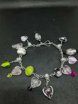 B #100  Flowers in Glass Hearts? What an Unique and Interesting Piece of Jewelry.