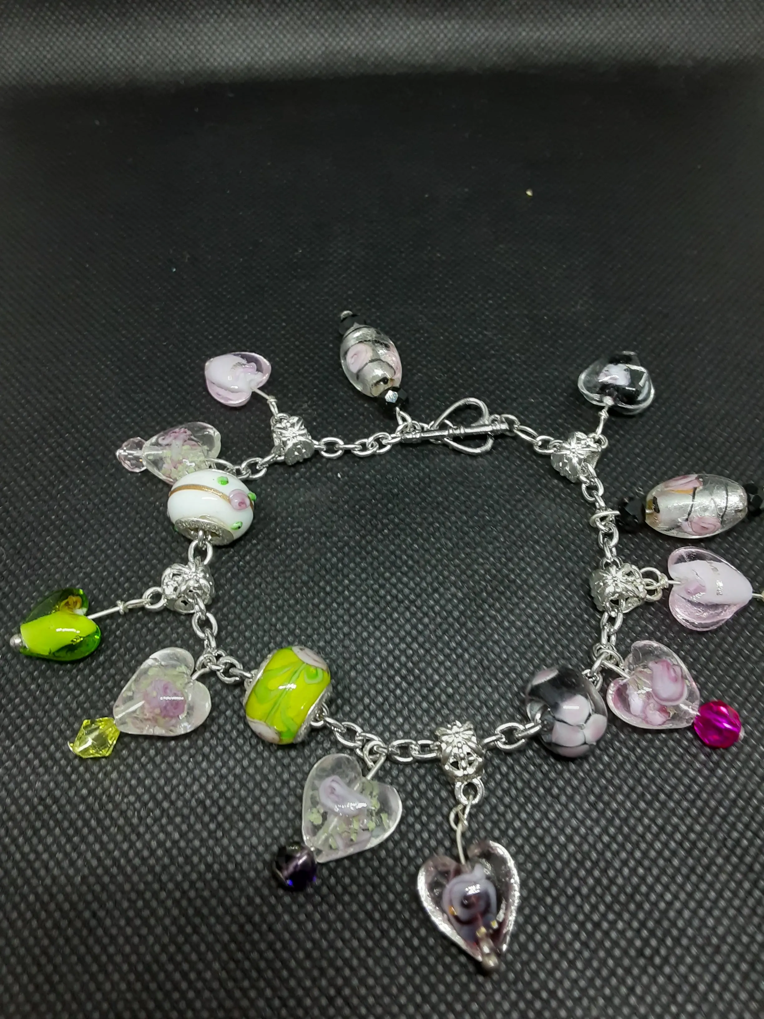 B #100  Flowers in Glass Hearts? What an Unique and Interesting Piece of Jewelry.