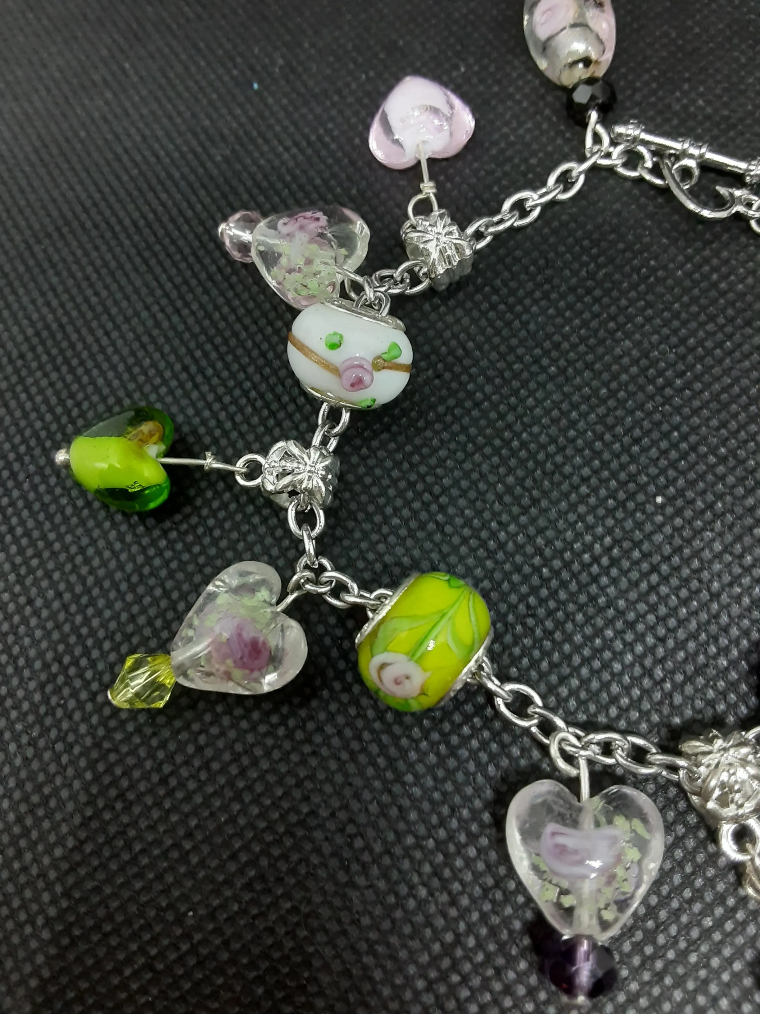 B #100  Flowers in Glass Hearts? What an Unique and Interesting Piece of Jewelry.