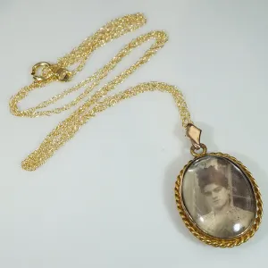 Serious Young Woman in Crystal & Gold Locket